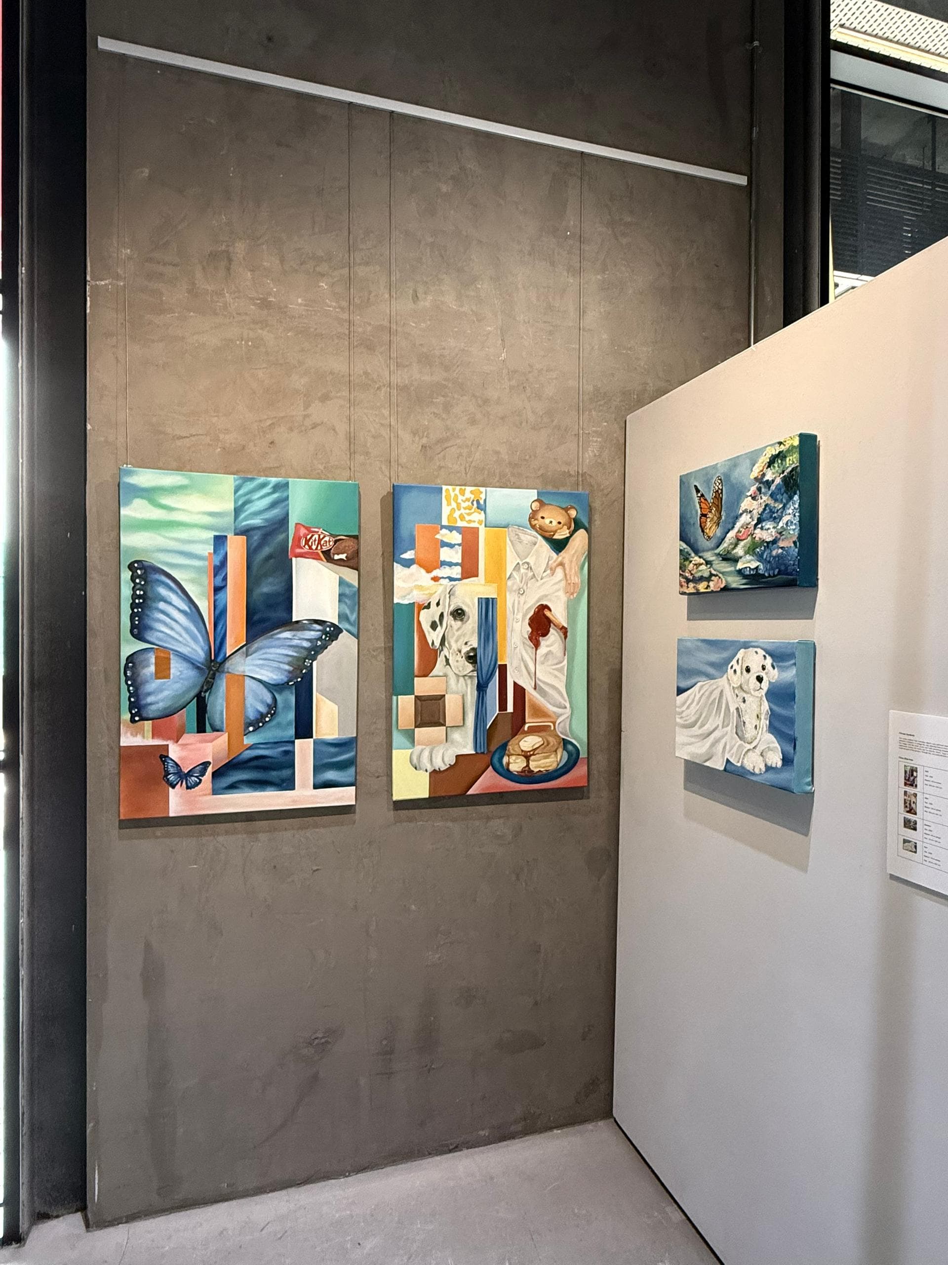 Butterfly and dog paintings displayed at the exhibition